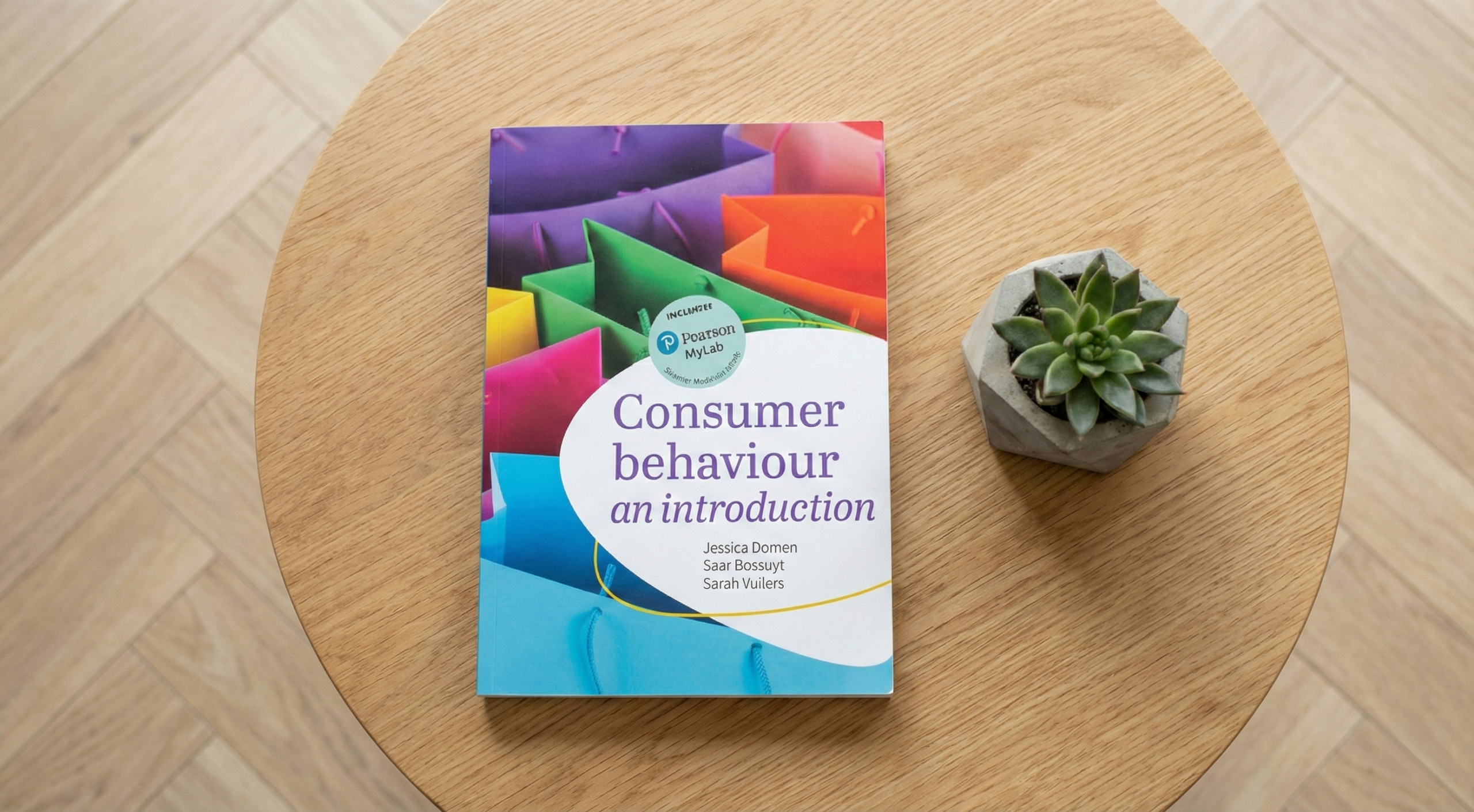 Consumer Behaviour: An Introduction – textbook on a wooden table