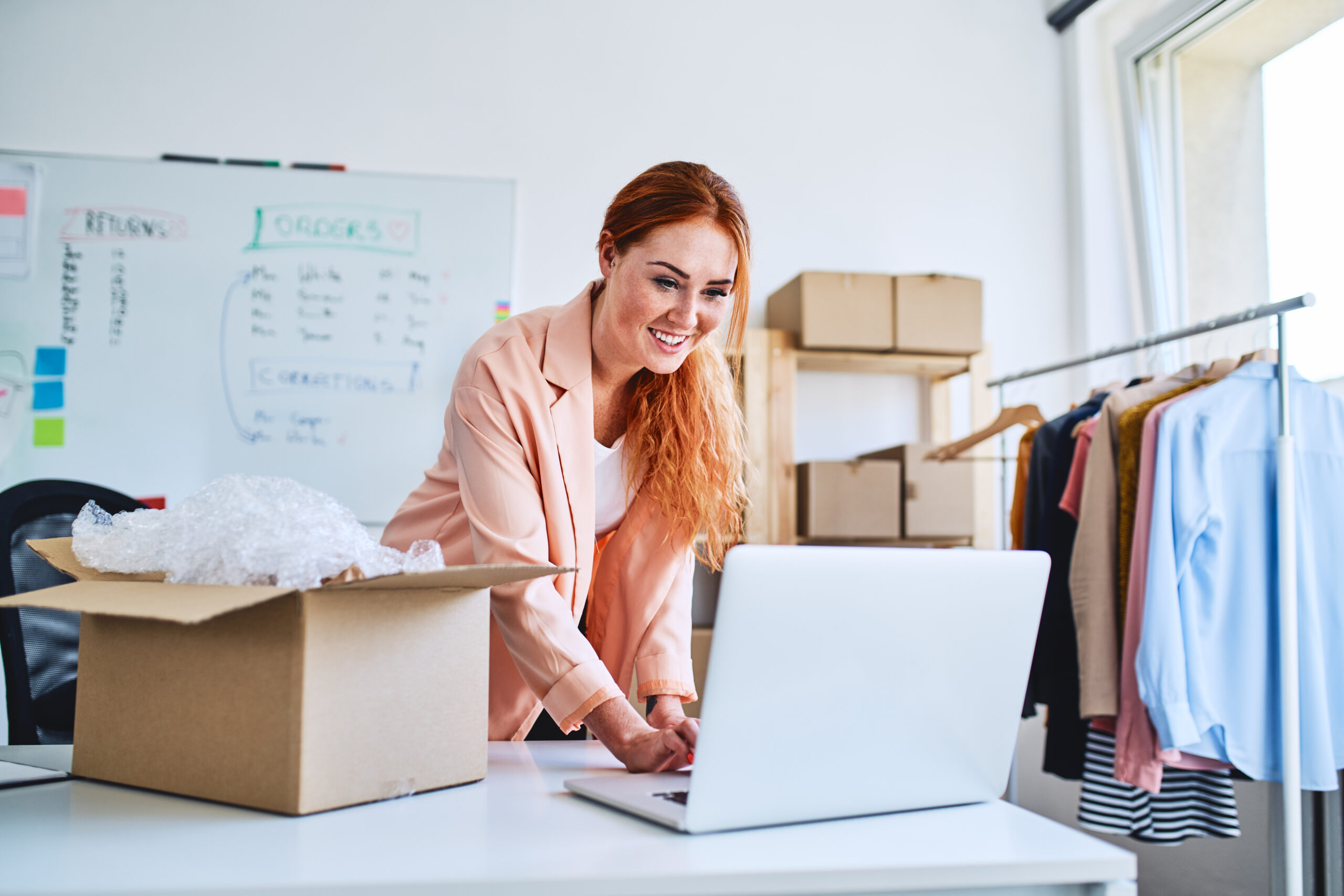 Woman managing online shop orders on a laptop, illustrating practical consumer behaviour and e-commerce decision-making Woman managing online shop orders on a laptop, illustrating practical consumer behaviour and e-commerce decision-making